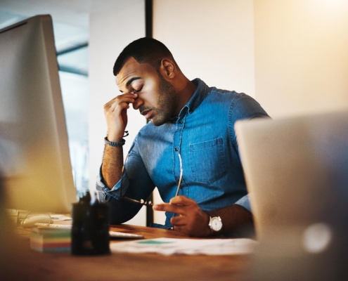 Person stressed at computer