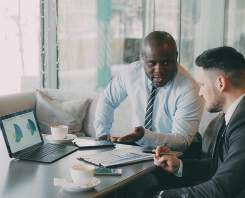 Two business people looking at charts