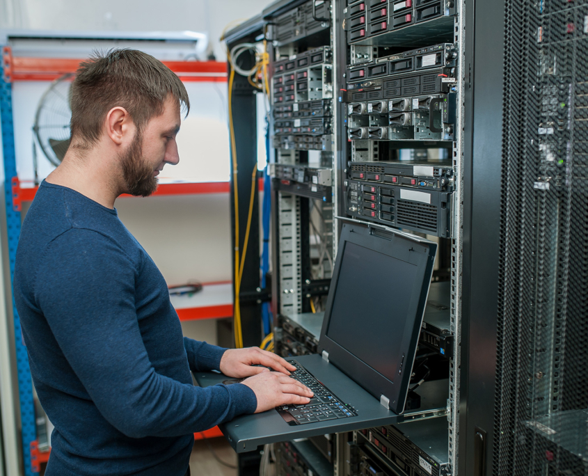 Network engineer working in server room