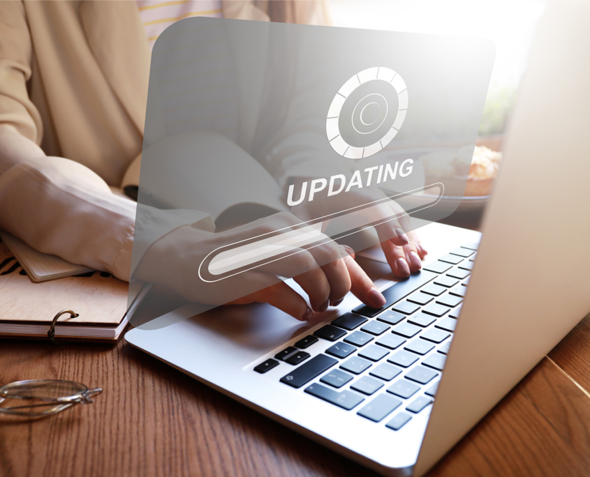 Young woman updating laptop software