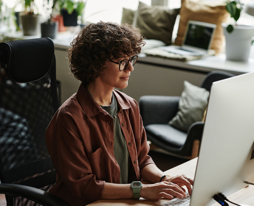 Person working on a computer in modern office