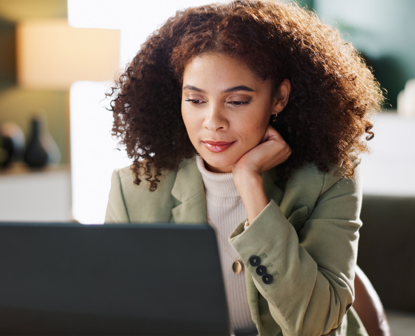 Office, employee and woman with laptop, reading and media coordinator
