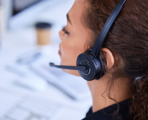Worker on call with headset in office